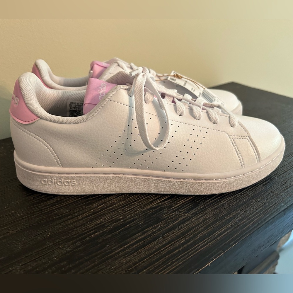 Brand New, never worn women’s Adidas tennis shoes.  White with pink trim.